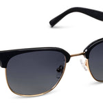 Peepers Houston Sunglasses in Black, browline frames with gold accents and gradient lenses, angled view
