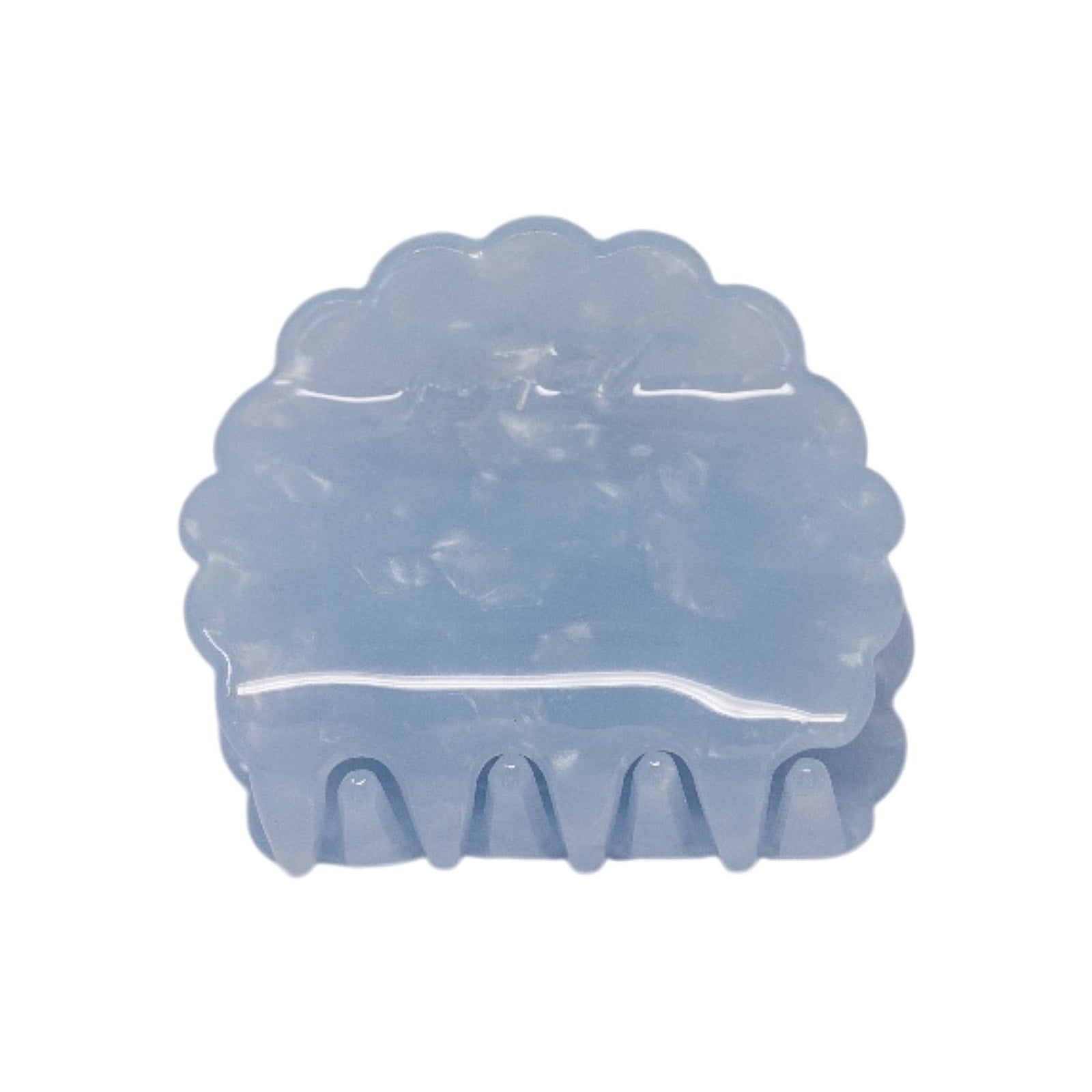 Petal claw clip in Moonstone, a translucent pale blue scalloped hair claw clip, on a white background.