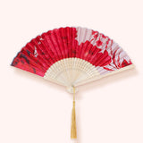 Powder Designs Satin Fan in Rouge Blooms, a red and pink floral folding fan with a gold tassel