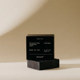 Preston Bar Soap in Leather, black box with a black charcoal soap bar beside it