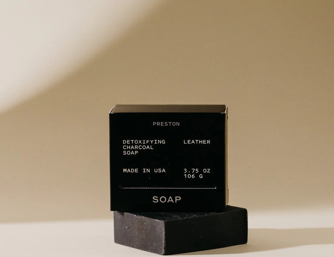 Preston Bar Soap in Leather, black box with a black charcoal soap bar beside it