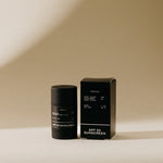 Preston Sunscreen Stick SPF 50, a matte black stick beside its black box