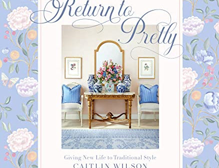 Return to Pretty book by Caitlin Wilson, a periwinkle floral cover with a styled entryway photo