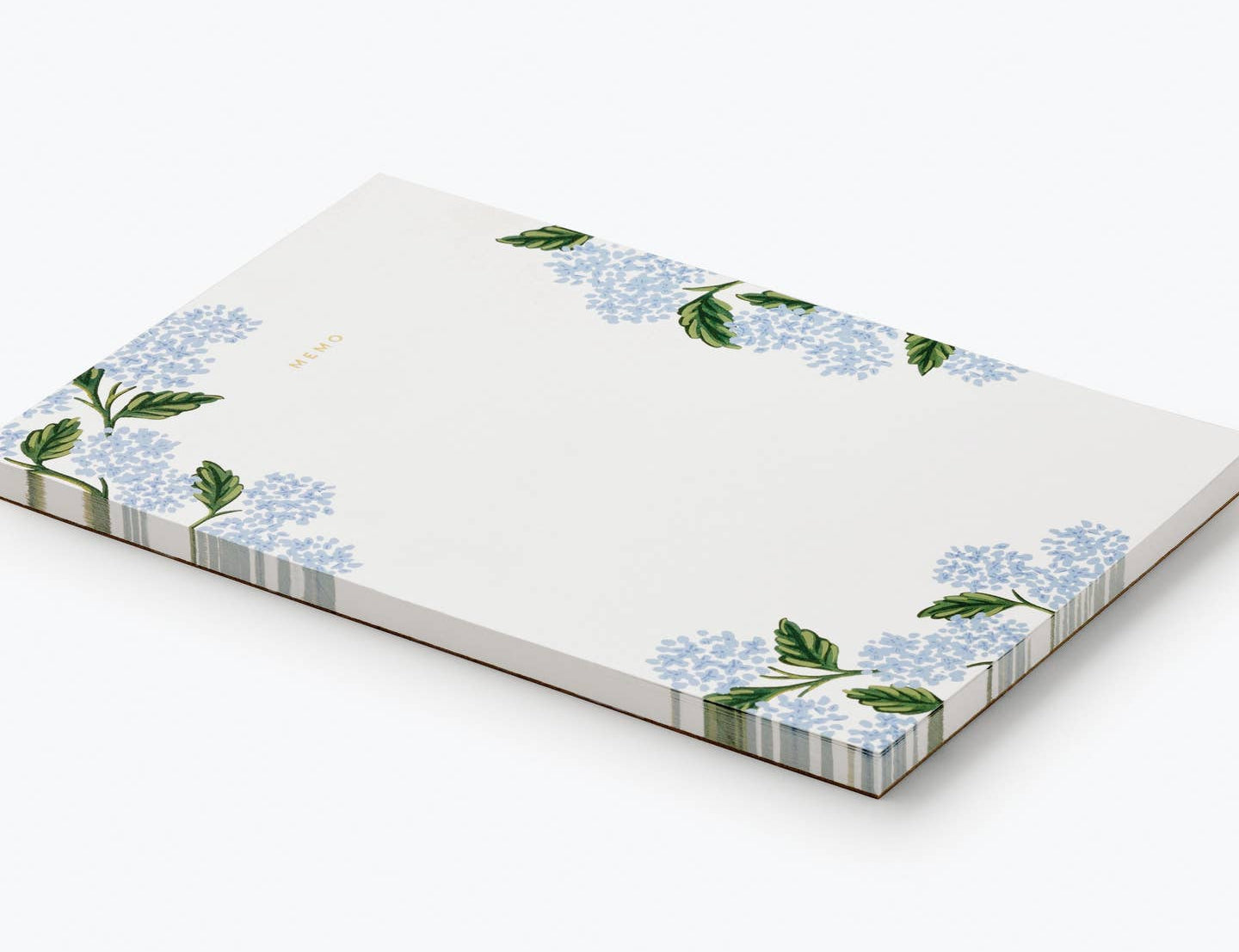 Rifle Paper Co. Hydrangea Memo Notepad shown at an angle with a striped edge
