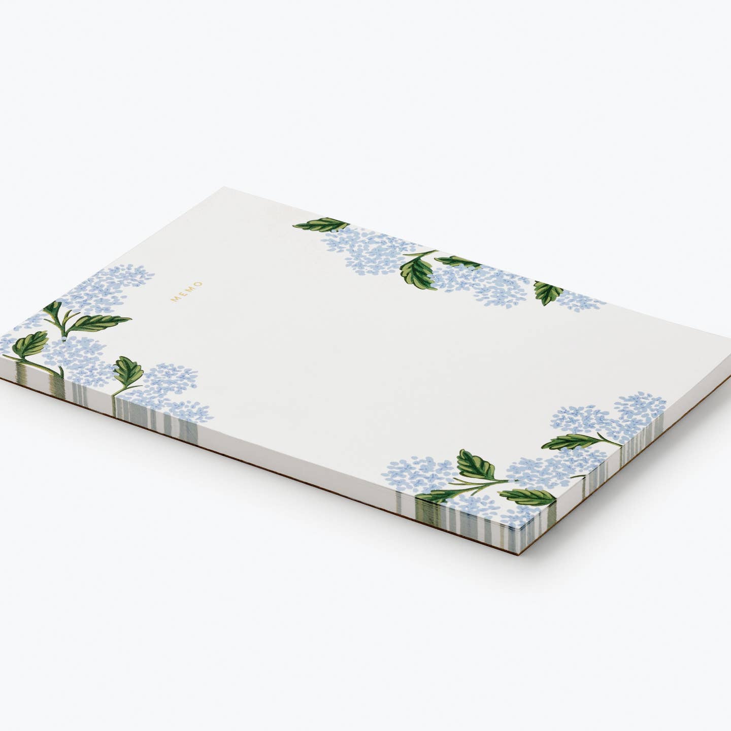 Rifle Paper Co. Hydrangea Memo Notepad shown at an angle with a striped edge