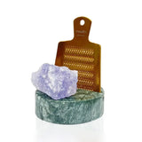 Rivsalt Green Marble Salt Grater, a copper grater with a purple rock salt crystal on a green marble stand