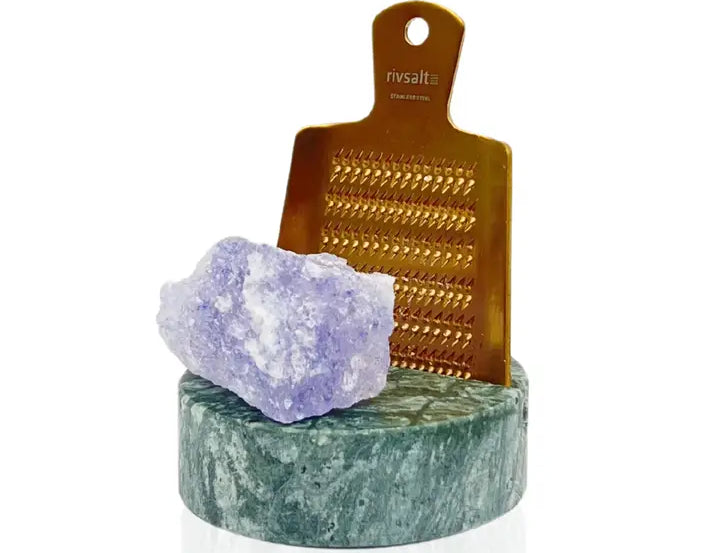 Rivsalt Green Marble Salt Grater, a copper grater with a purple rock salt crystal on a green marble stand