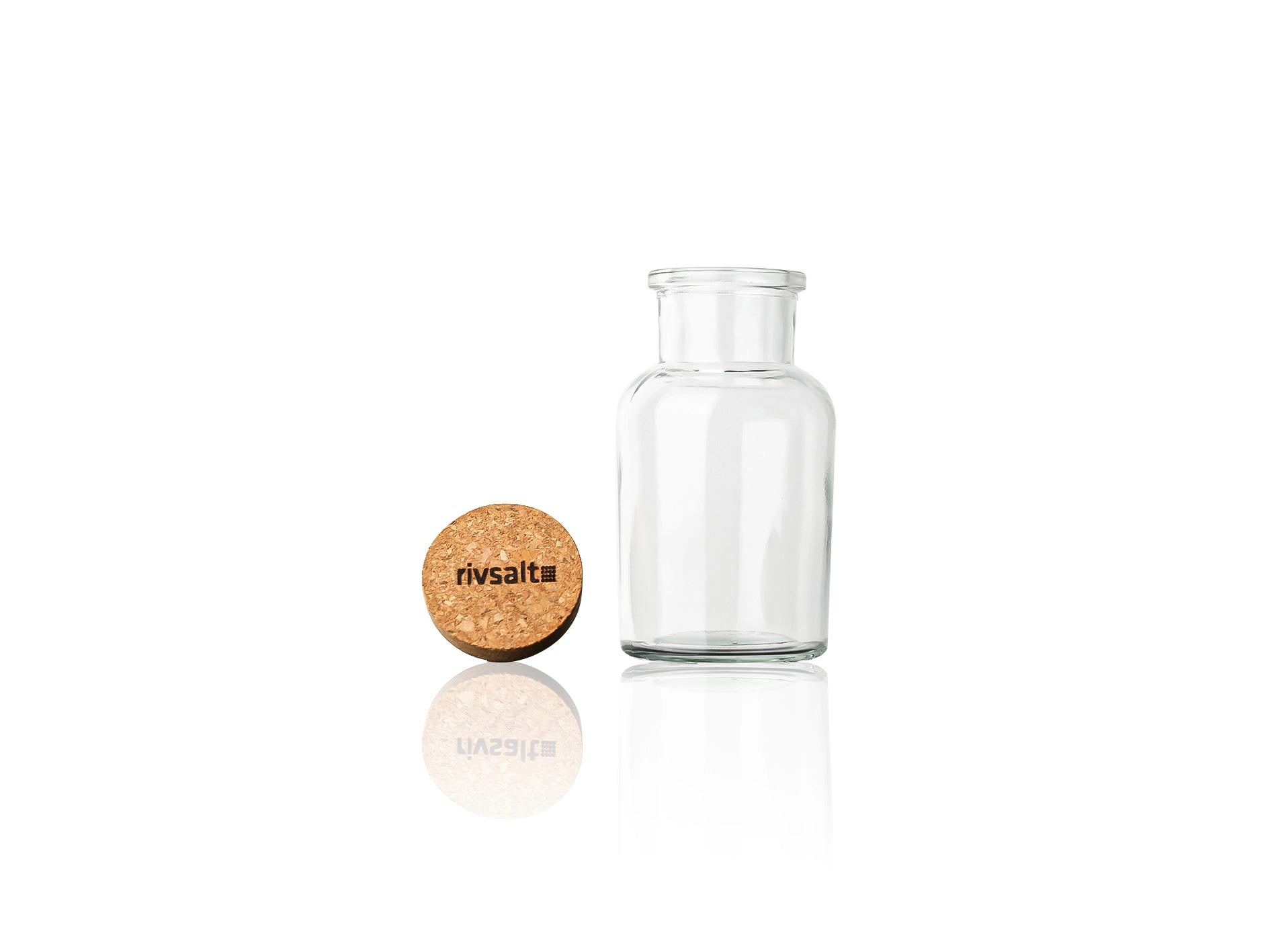 Empty Rivsalt glass jar with its cork stopper beside it