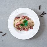 Plate of pasta carbonara garnished with Rivsalt Java Long Pepper
