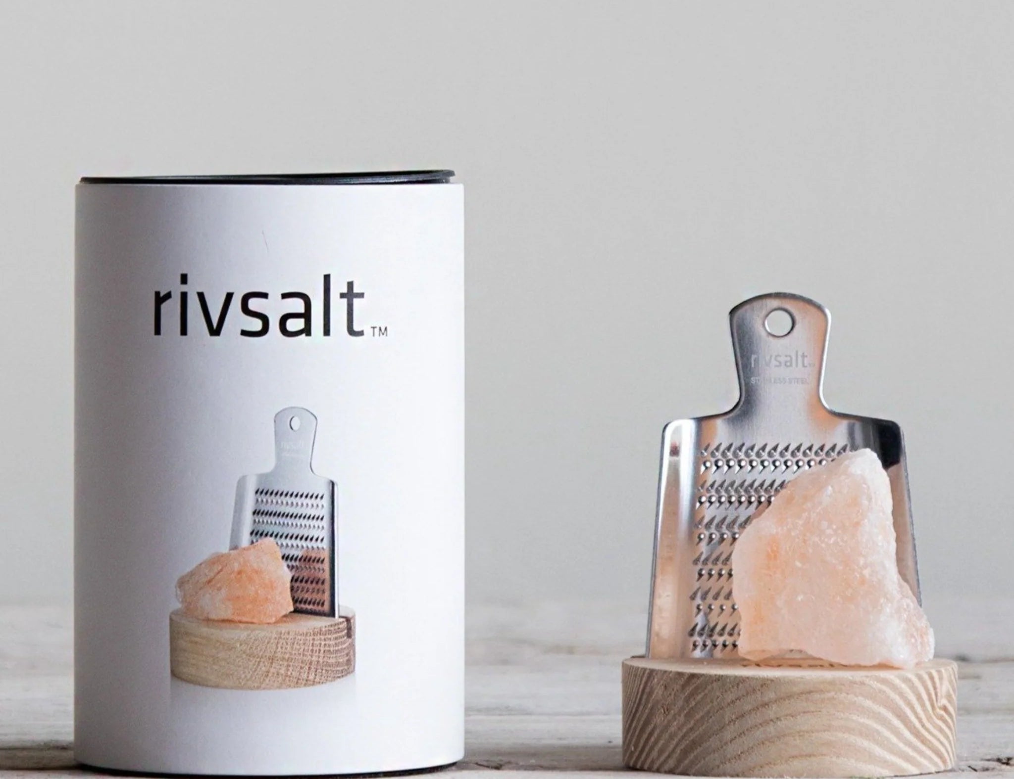 Rivsalt The Original Stainless Steel Salt Grater with a pink Himalayan salt rock beside its white tube