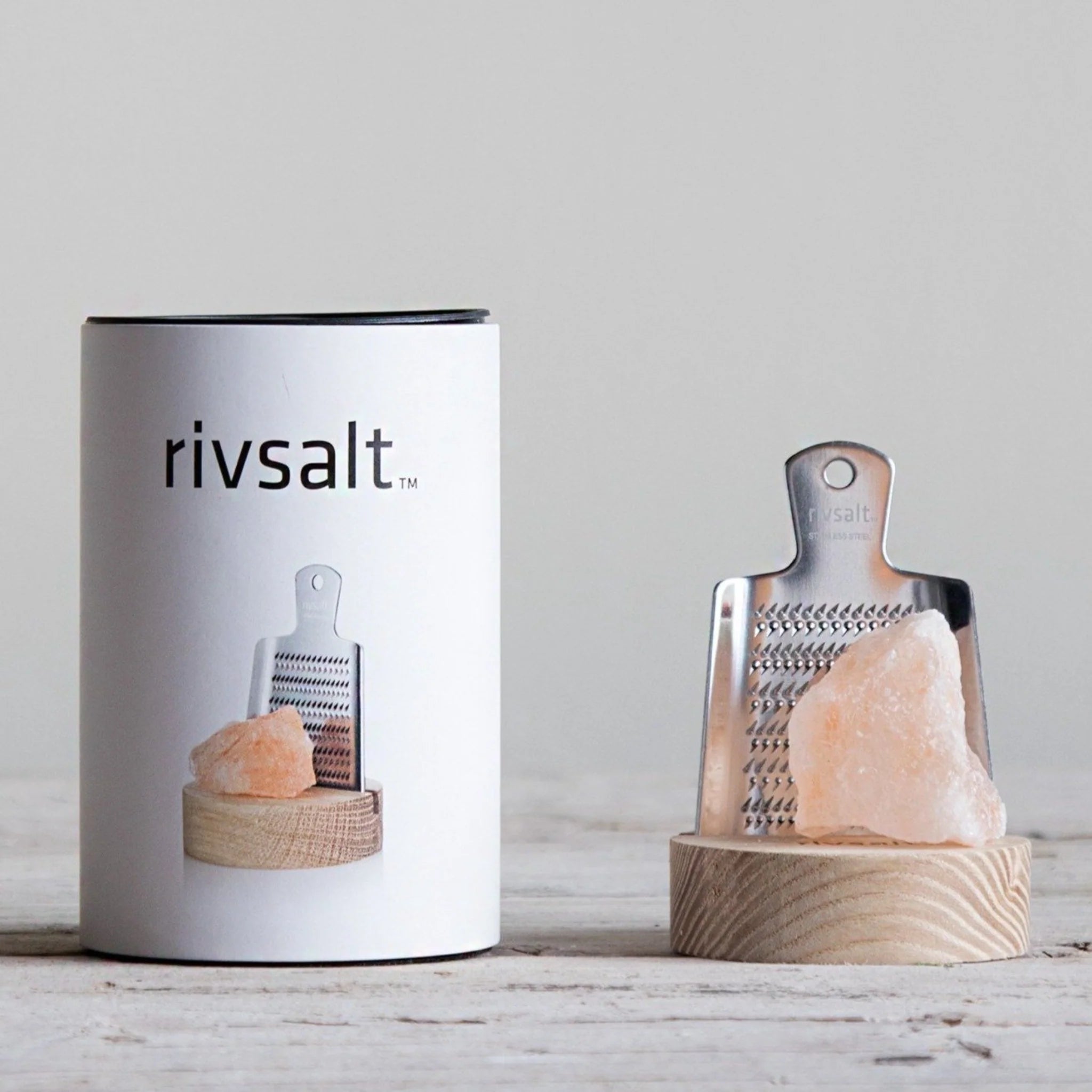 Rivsalt The Original Stainless Steel Salt Grater with a pink Himalayan salt rock beside its white tube