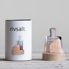 Rivsalt The Original Stainless Steel Salt Grater with a pink Himalayan salt rock beside its white tube