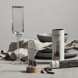 Rivsalt Pepper Stainless Steel Grater on a table set with a champagne flute and linen