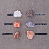 Rivsalt salt rocks labeled Halit, Kala Namak, Himalayan, Persian Blue, Austrian Alp and Bolivian Rose