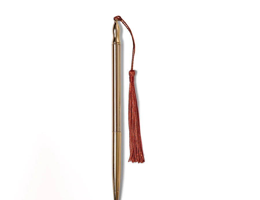 RoomyTown 24k Gold Plated Ballpoint Pen with a Rust red silk tassel, slim gold pen on white