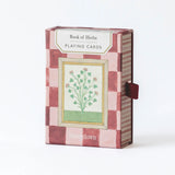 RoomyTown Book of Herbs Playing Cards in a pink and burgundy checkered box with a botanical illustration