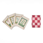 RoomyTown Book of Herbs Playing Cards fanned out showing illustrated herb face cards and the checkered back