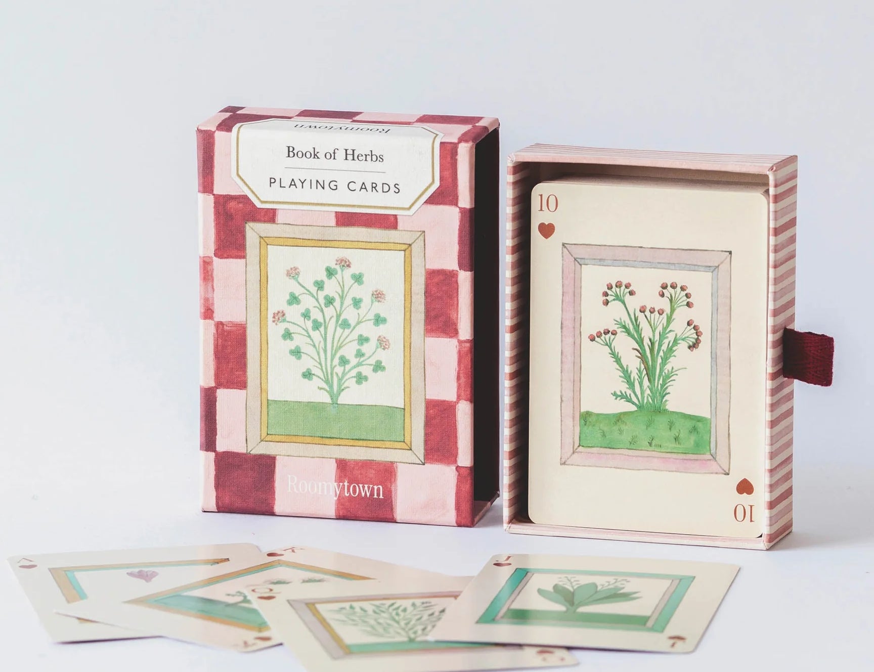 RoomyTown Book of Herbs Playing Cards box open with illustrated herb cards fanned in front