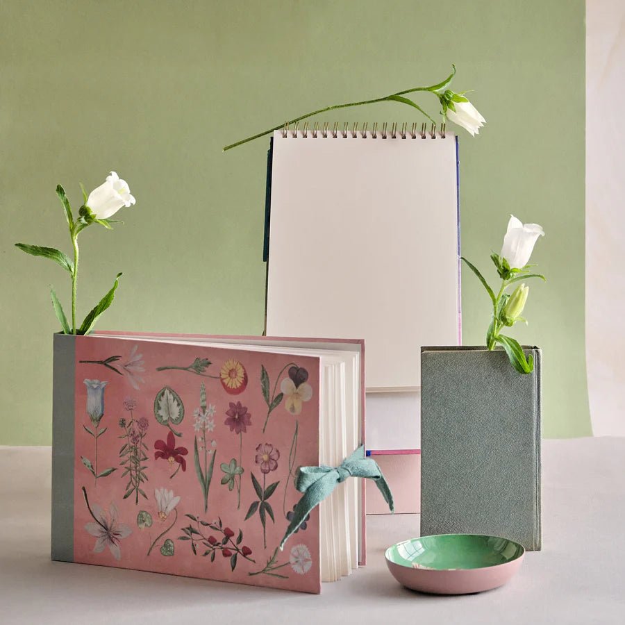RoomyTown Festival of Flowers Artist Sketchbook styled with flowers and a green sketchbook
