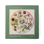 RoomyTown Flower Clock 500-Piece Round Jigsaw Puzzle, a green box with a Linnaean flower clock illustration