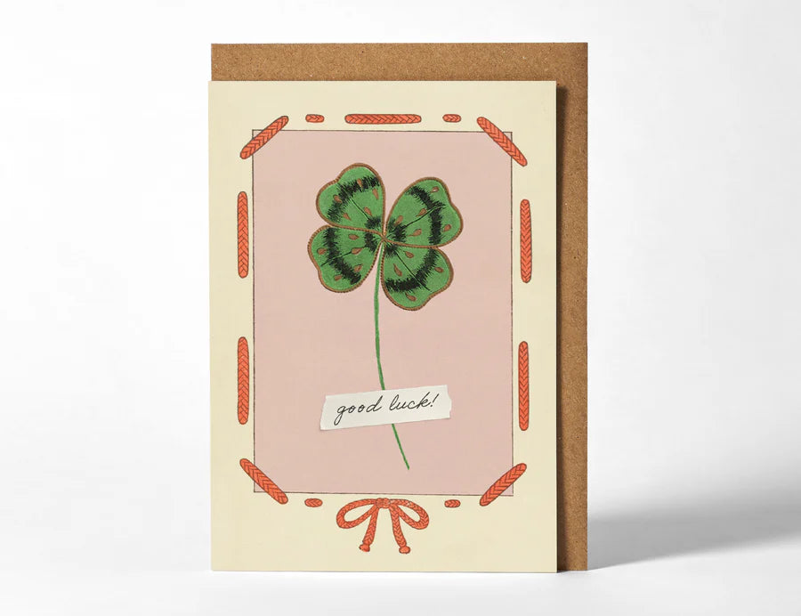RoomyTown Good Luck Clover Greeting Card, a pink card with a four-leaf clover illustration and kraft envelope