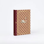 RoomyTown Lay-Flat Swan Journal, a burgundy and tan journal with a swan and gold corner details