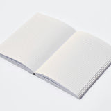 RoomyTown Lay-Flat Swan Journal open to blank lined pages showing the lay-flat binding