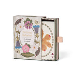 RoomyTown The Living Herbarium Playing Cards box open with a card showing an orange pressed leaf