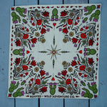 Rooted & Wild Adventure Co. Desert Bloom Bandana laid flat showing the full red and green cactus flower print