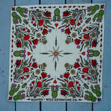 Rooted & Wild Adventure Co. Desert Bloom Bandana laid flat showing the full red and green cactus flower print