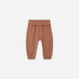 Rylee & Cru Baby Pant in Poppy, rust-brown ribbed-waist baby pants on white