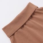 Rylee & Cru Baby Pant in Poppy, close-up of the rust-brown fold-over ribbed waistband