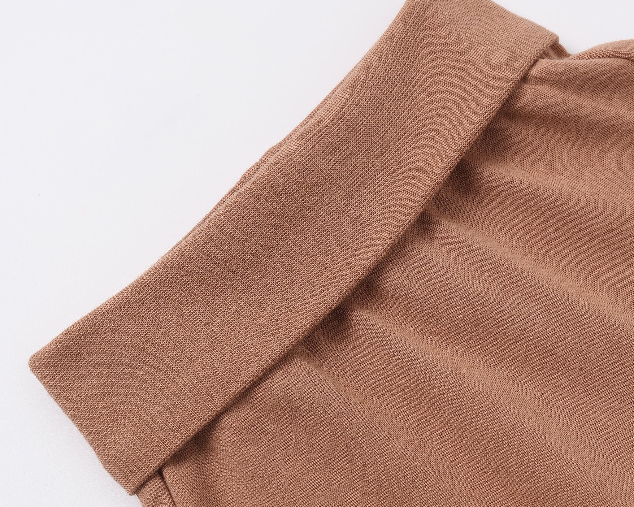Rylee & Cru Baby Pant in Poppy, close-up of the rust-brown fold-over ribbed waistband