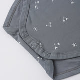 Rylee & Cru Bamboo Short Sleeve Bodysuit in Ocean, close-up of the snap closure and star print