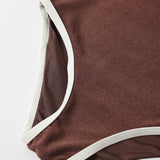 Close-up of the brown ribbed fabric and cream trim on the Rylee & Cru Chocolate Moxie One-Piece