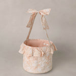 Rylee & Cru Easter Basket in Pastel Garden with a ruffle trim and bow handle, front view