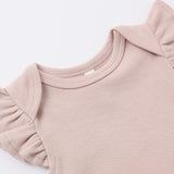 Close-up of the ruffled flutter sleeve on the Rylee & Cru Flutter Sleeve Bodysuit in Blush