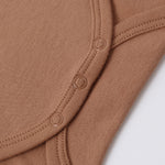 Close-up of the snap closures on the Rylee & Cru Flutter Sleeve Bodysuit in Poppy