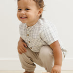 Laughing toddler crouching in the Rylee & Cru Jaxson Shirt in Blue Plaid