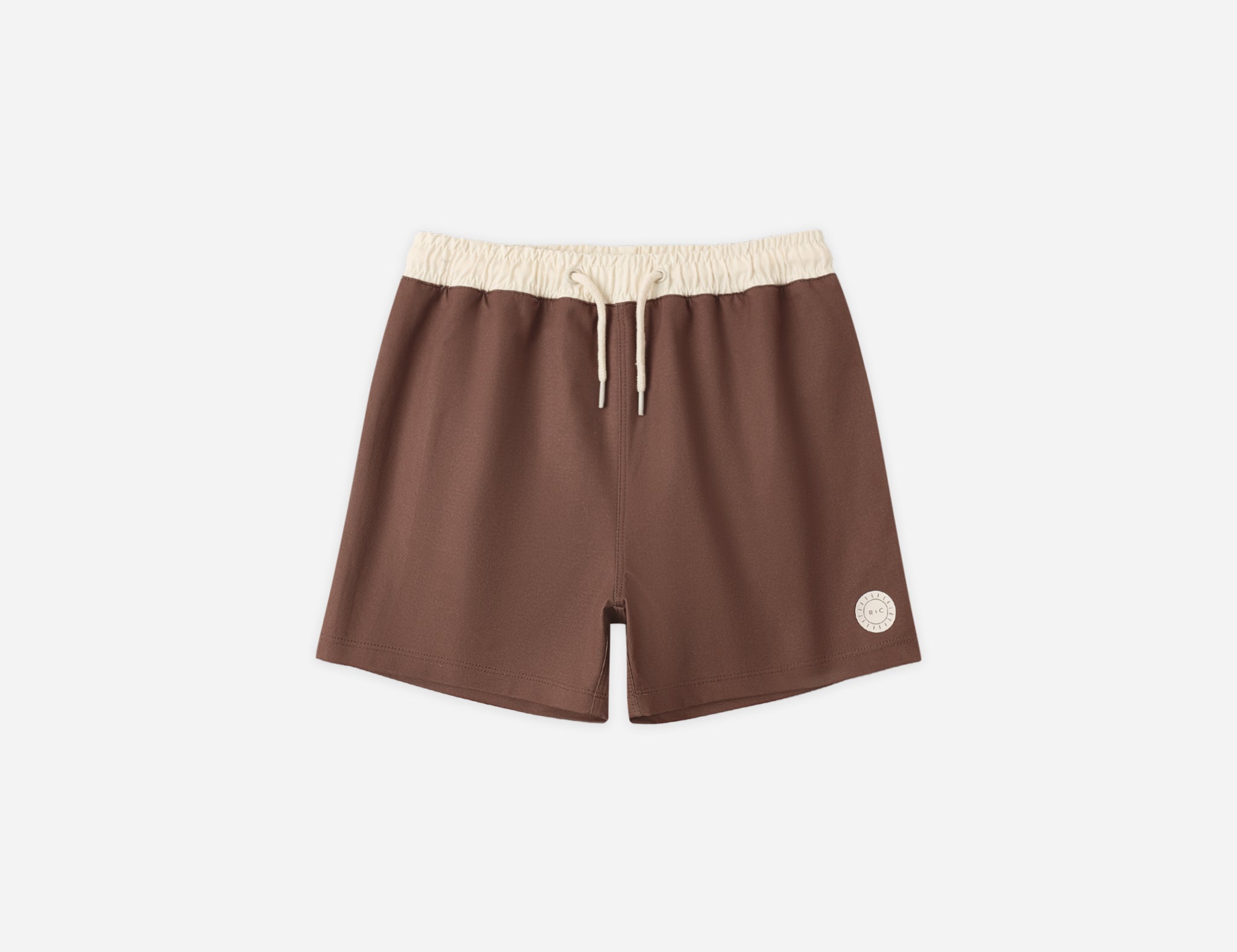 Rylee & Cru Paneled Boardshort in Chocolate, brown swim shorts with a cream waistband, laid flat