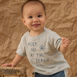 Smiling baby in a Meet Me at the Beach tee and Rylee & Cru Paneled Boardshort in Marine