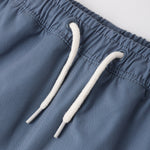 Close-up of the drawstring waistband on the Rylee & Cru Paneled Boardshort in Marine