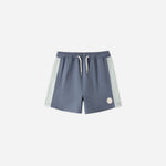 Rylee & Cru Paneled Boardshort in Marine, slate blue swim shorts with light blue side panels, laid flat
