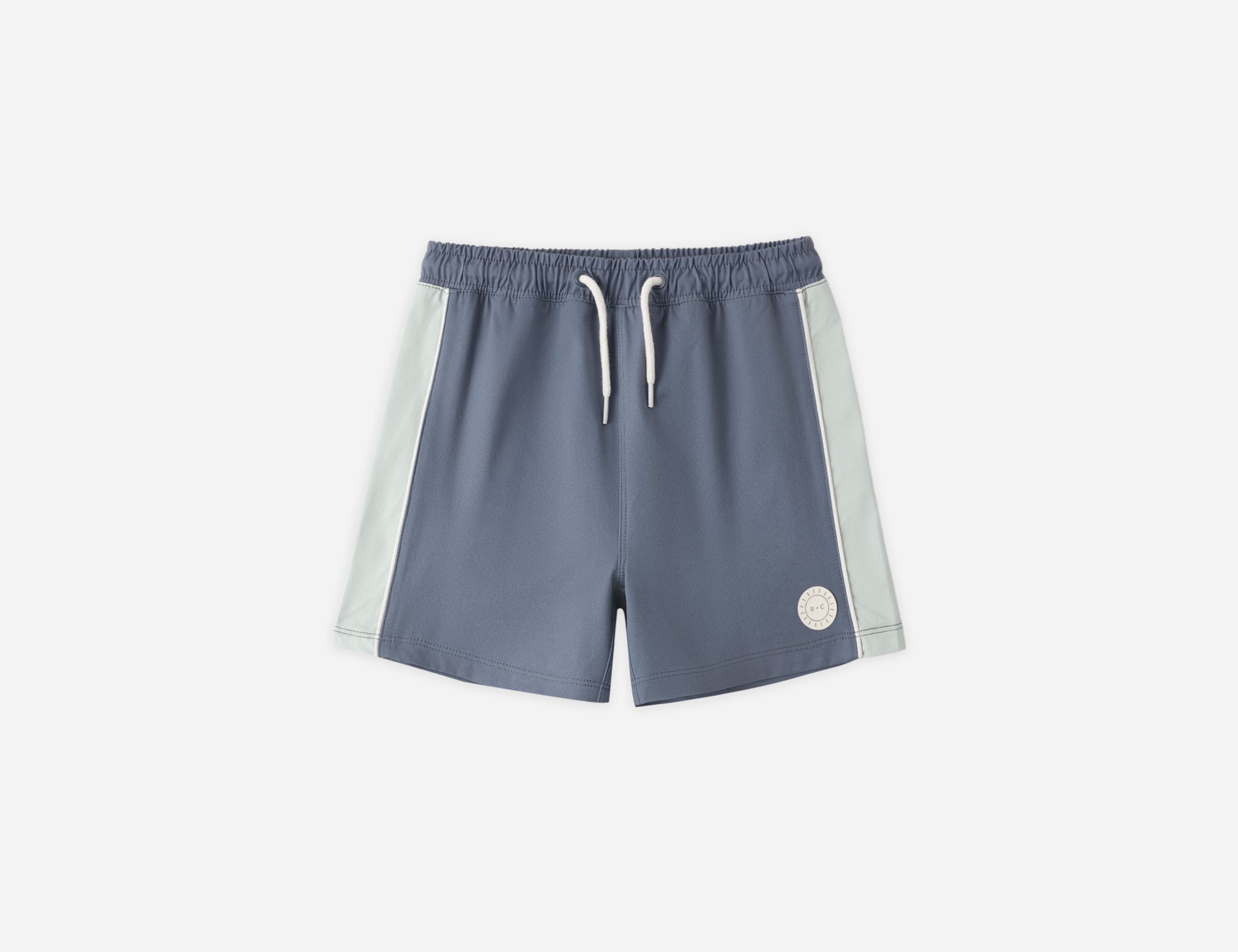 Rylee & Cru Paneled Boardshort in Marine, slate blue swim shorts with light blue side panels, laid flat
