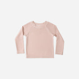 Rylee & Cru Rashguard Long Sleeve in Blush, a pale pink baby swim top, laid flat
