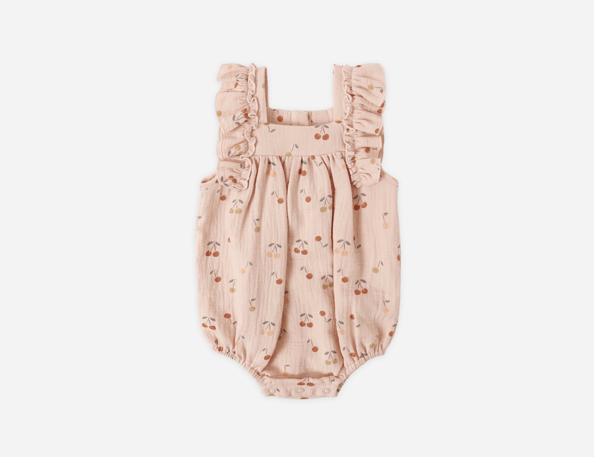 Rylee & Cru Ruffle Romper in Cherries, a blush pink baby romper with a cherry print and ruffle sleeves