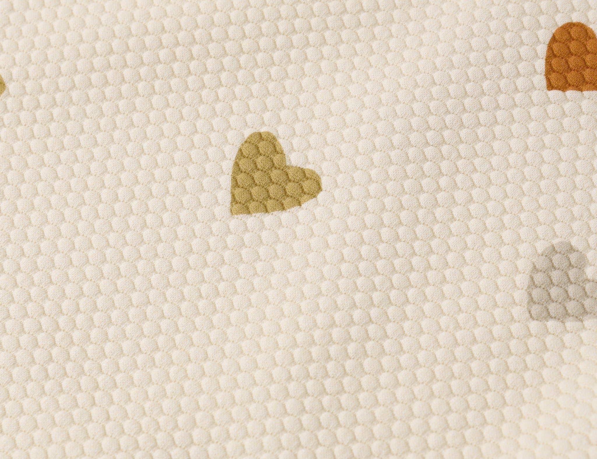 Close-up of the multicolor heart print on the Rylee & Cru Scoop Back One-Piece Swimsuit in Confetti Hearts
