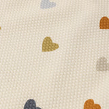 Close-up of the multicolor heart print on the Rylee & Cru Scoop Back One-Piece Swimsuit in Confetti Hearts