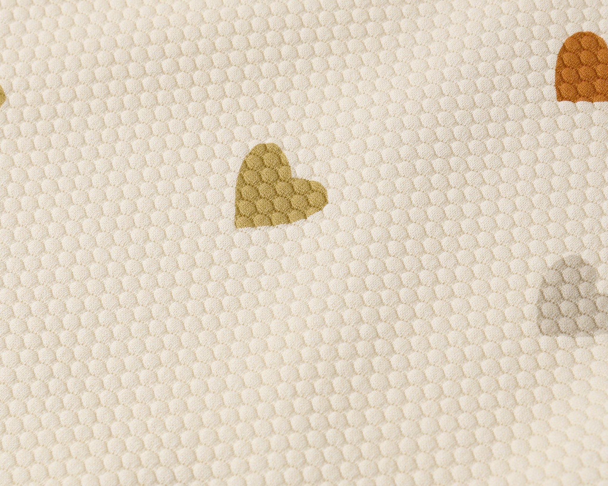 Close-up of the multicolor heart print on the Rylee & Cru Scoop Back One-Piece Swimsuit in Confetti Hearts
