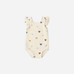 Rylee & Cru Scoop Back One-Piece Swimsuit in Confetti Hearts, a cream baby swimsuit with multicolor hearts and ruffle straps